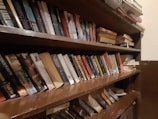 Photo showing a bookshelf filled with legal books and references.