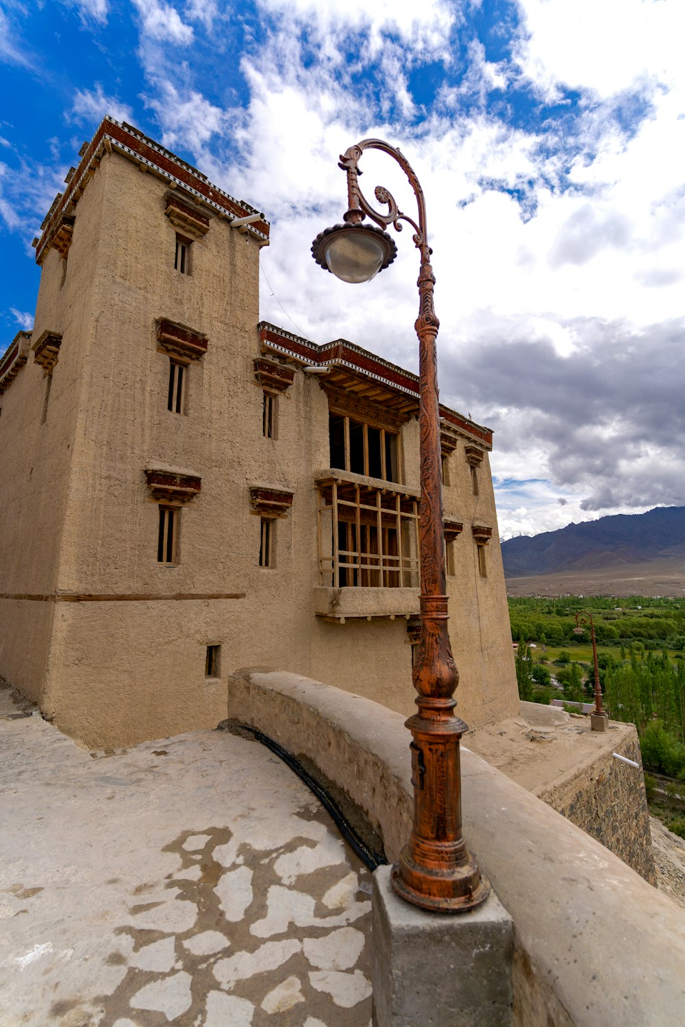 a lamp post in front of a building