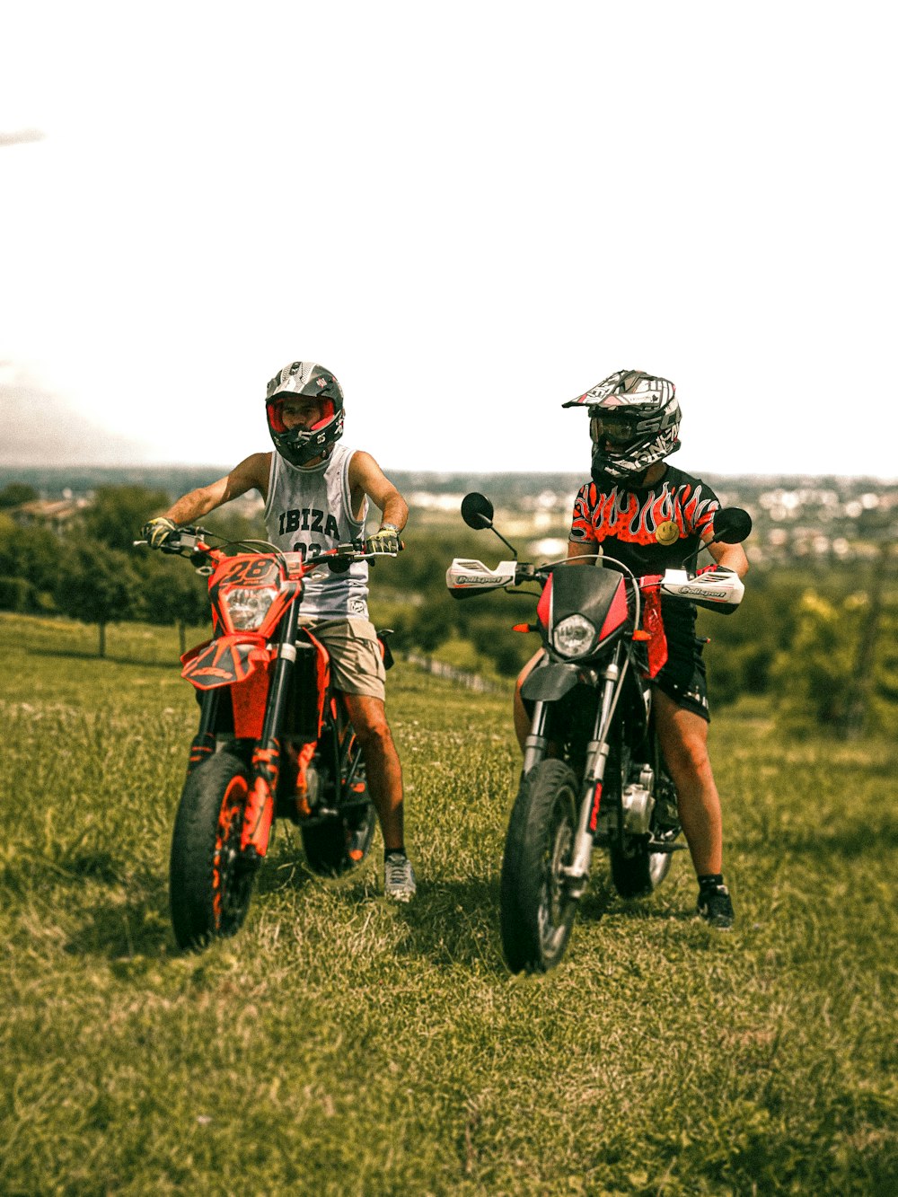 a couple of people that are on some dirt bikes