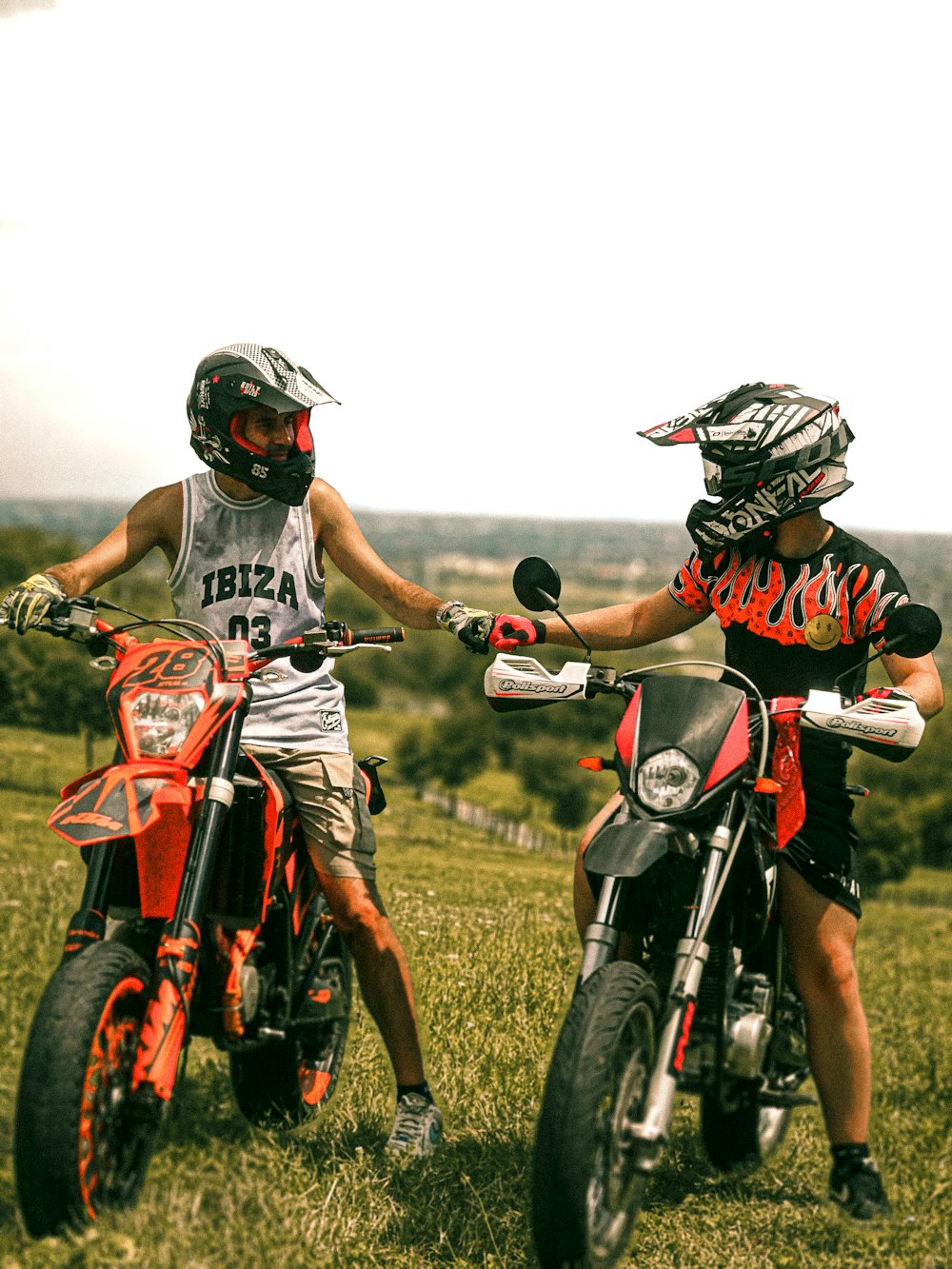 a couple of people that are on some dirt bikes