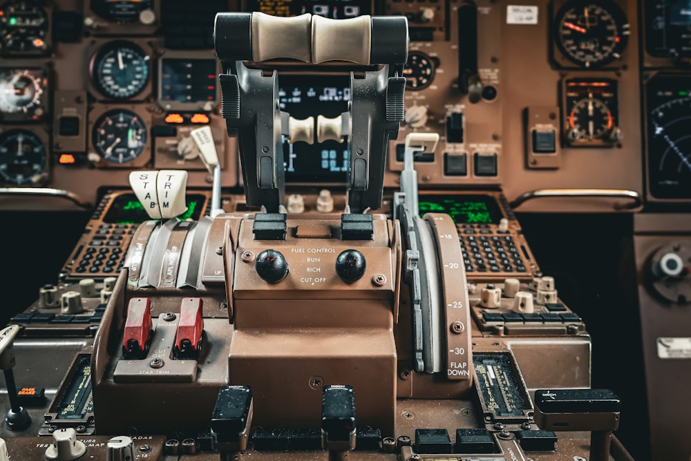 the cockpit of an airplane with many controls