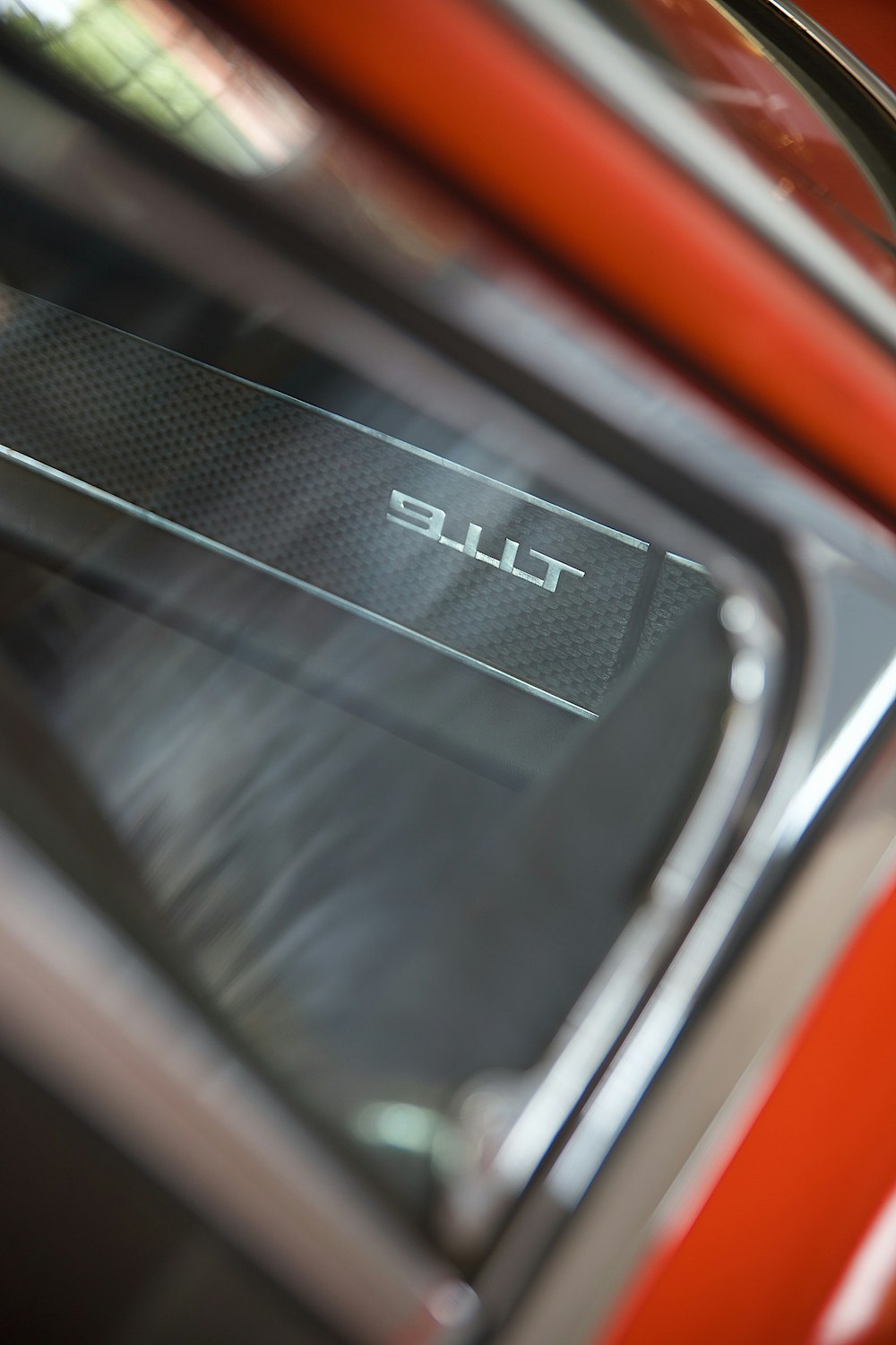 a close up of the emblem on a red car