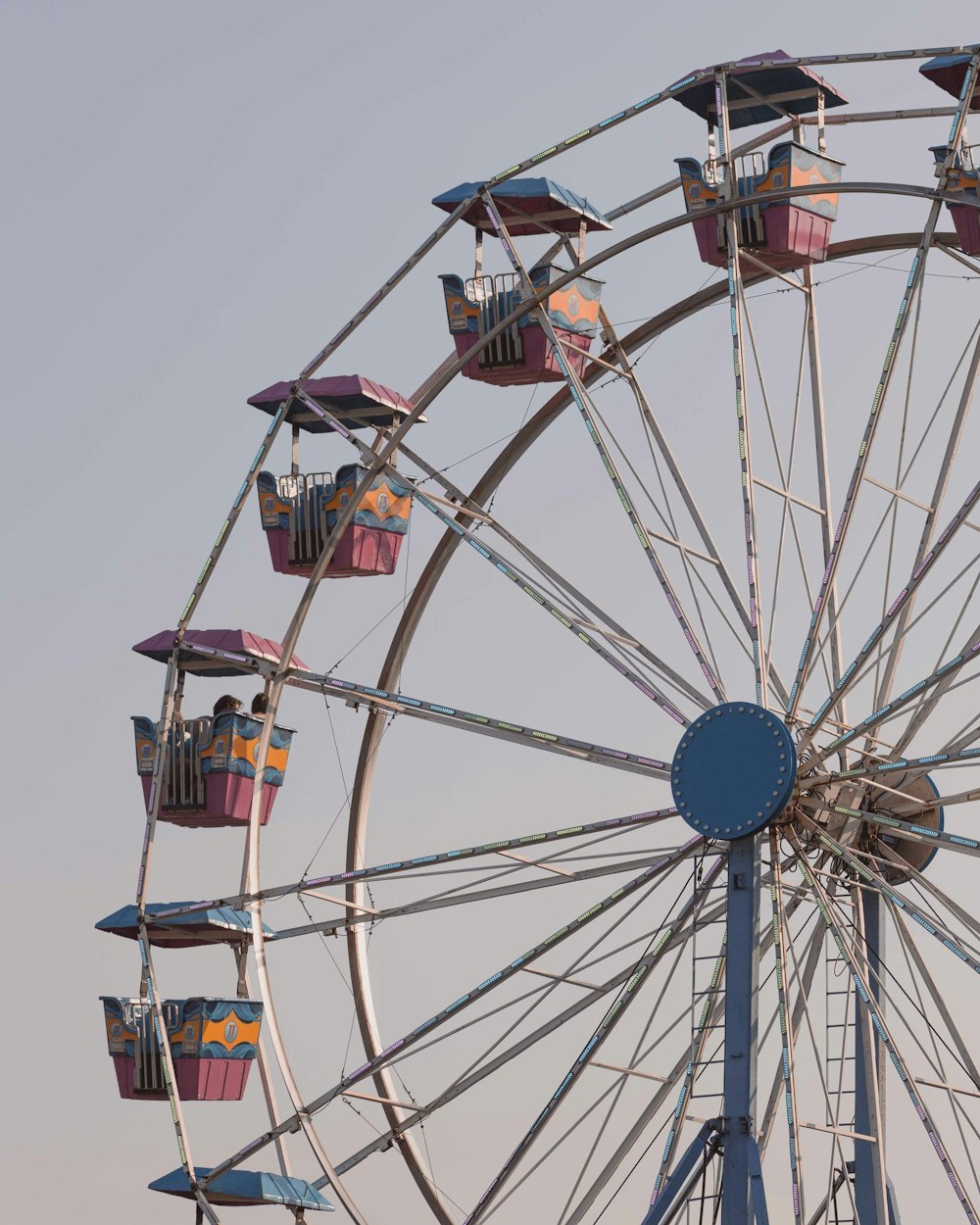 a ferris wheel with several people on it