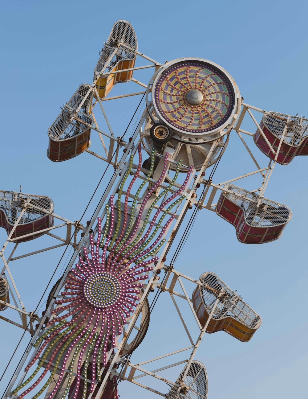 a ferris wheel with a clock on top of it