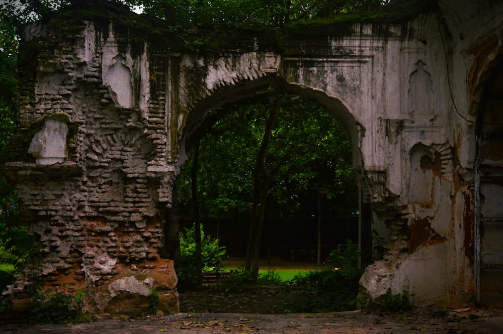 an old building with a stone arch in the middle of it