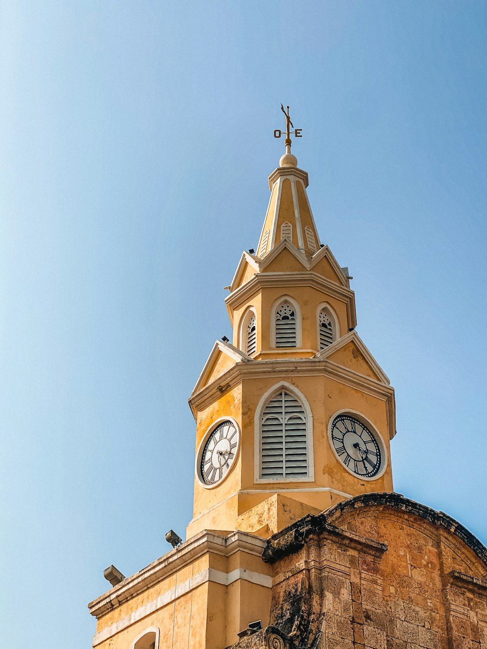 a tall tower with a clock on the top of it