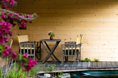 Backyard garden with a small patio set perfect for morning coffee or evening chats.