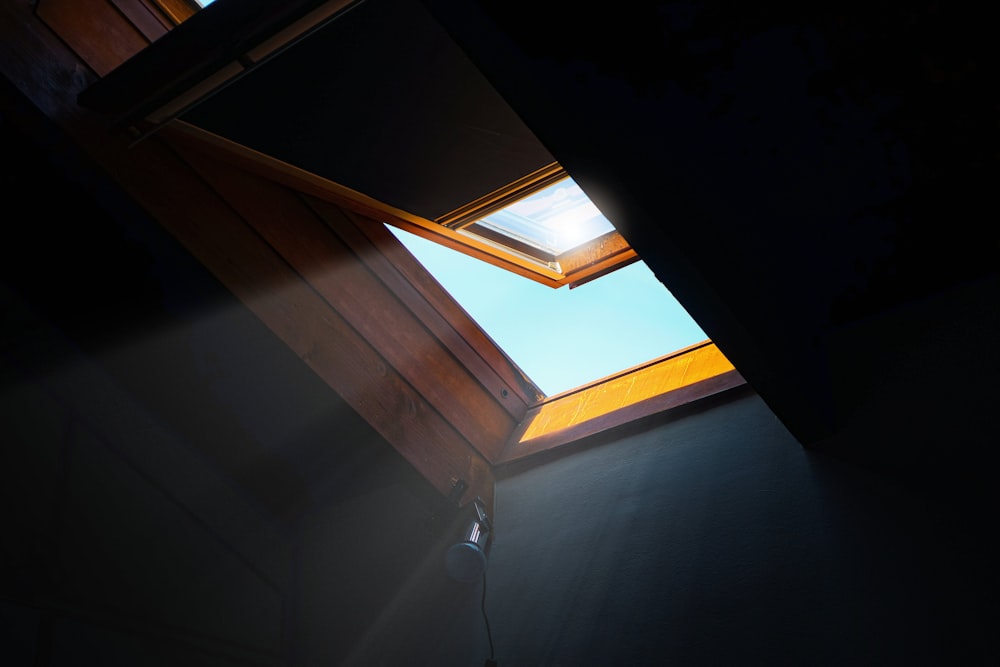 a window with a skylight shining in it
