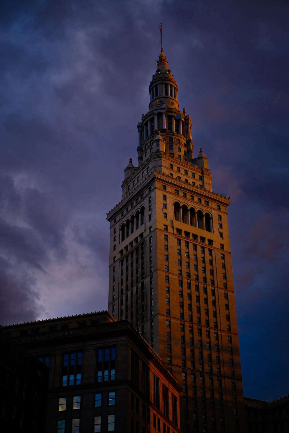 a tall building with a clock on the top of it