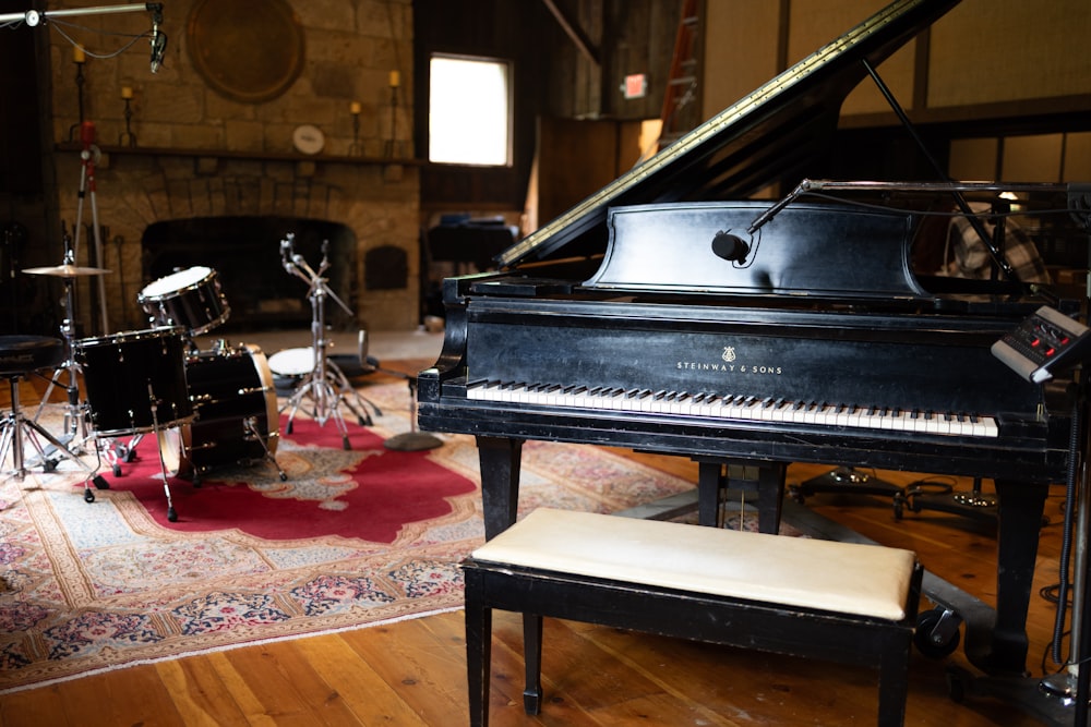 a piano and a stool in a room