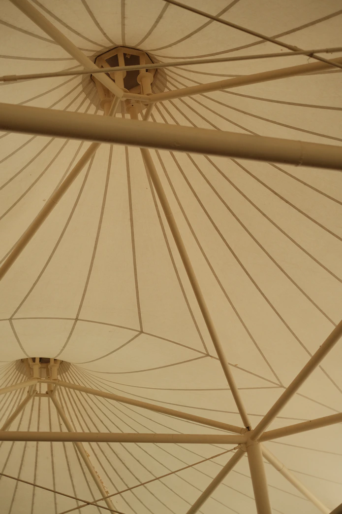 a close up of a large white umbrella