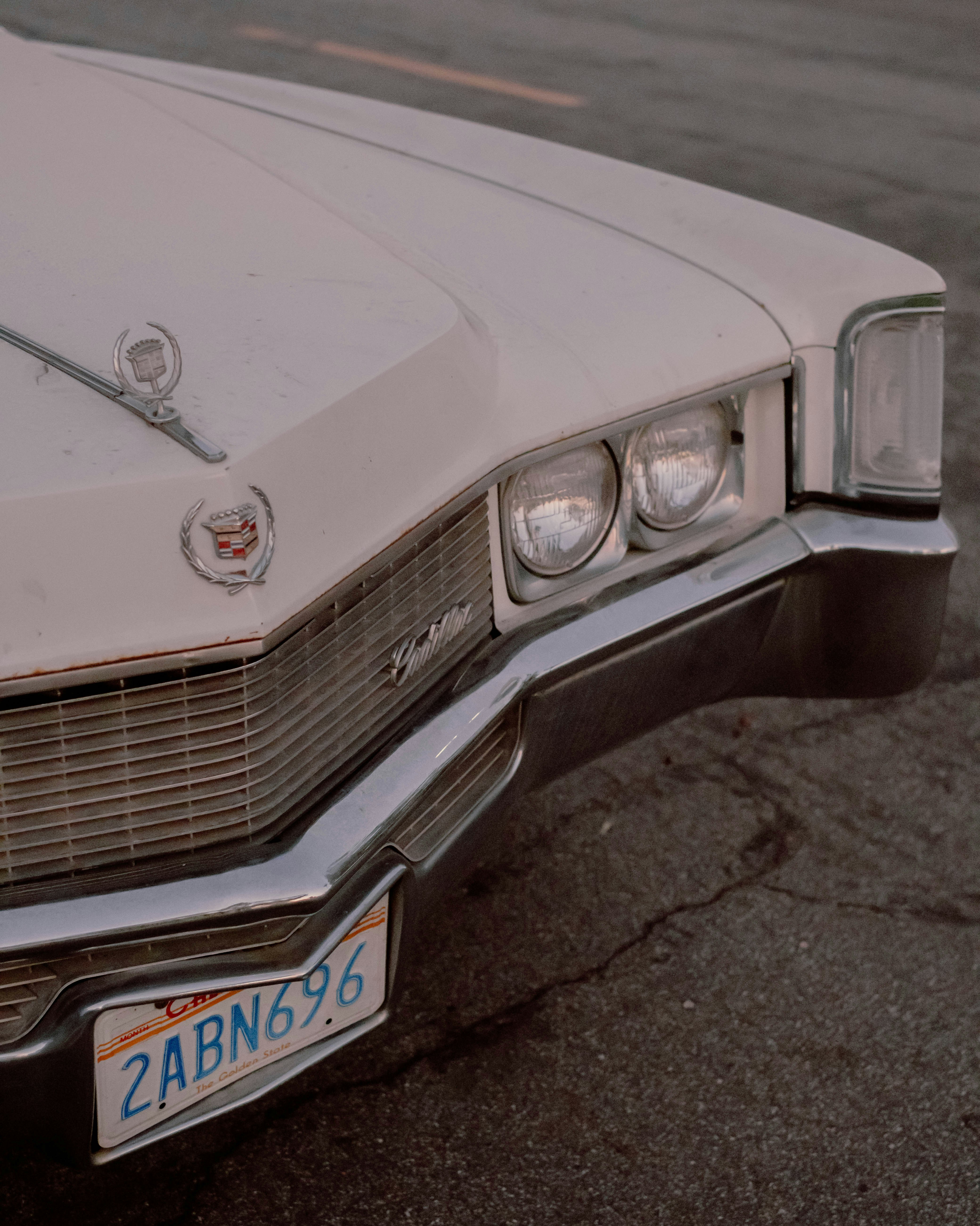 a close up of the front of a white car