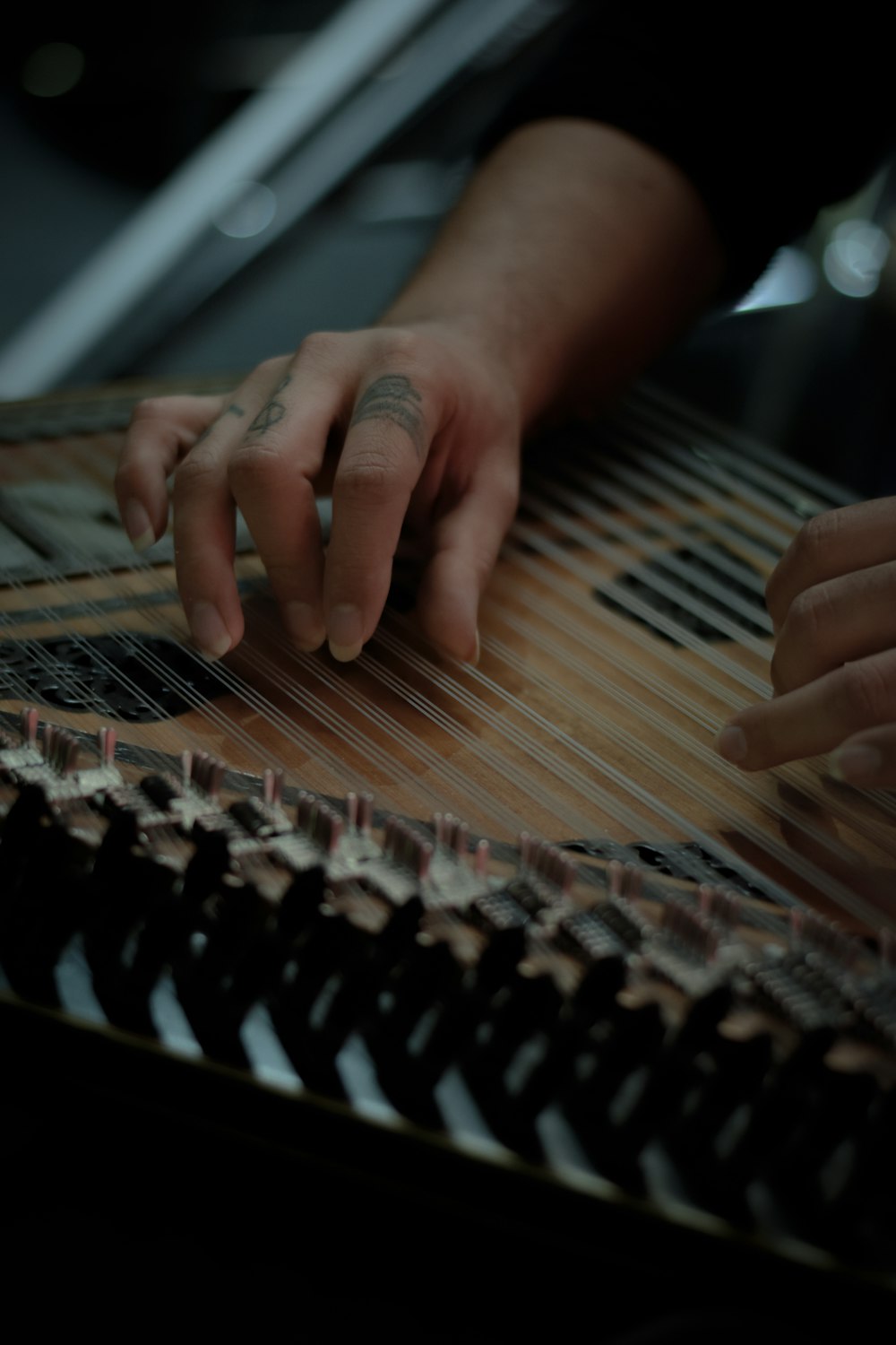 a close up of a person playing a musical instrument