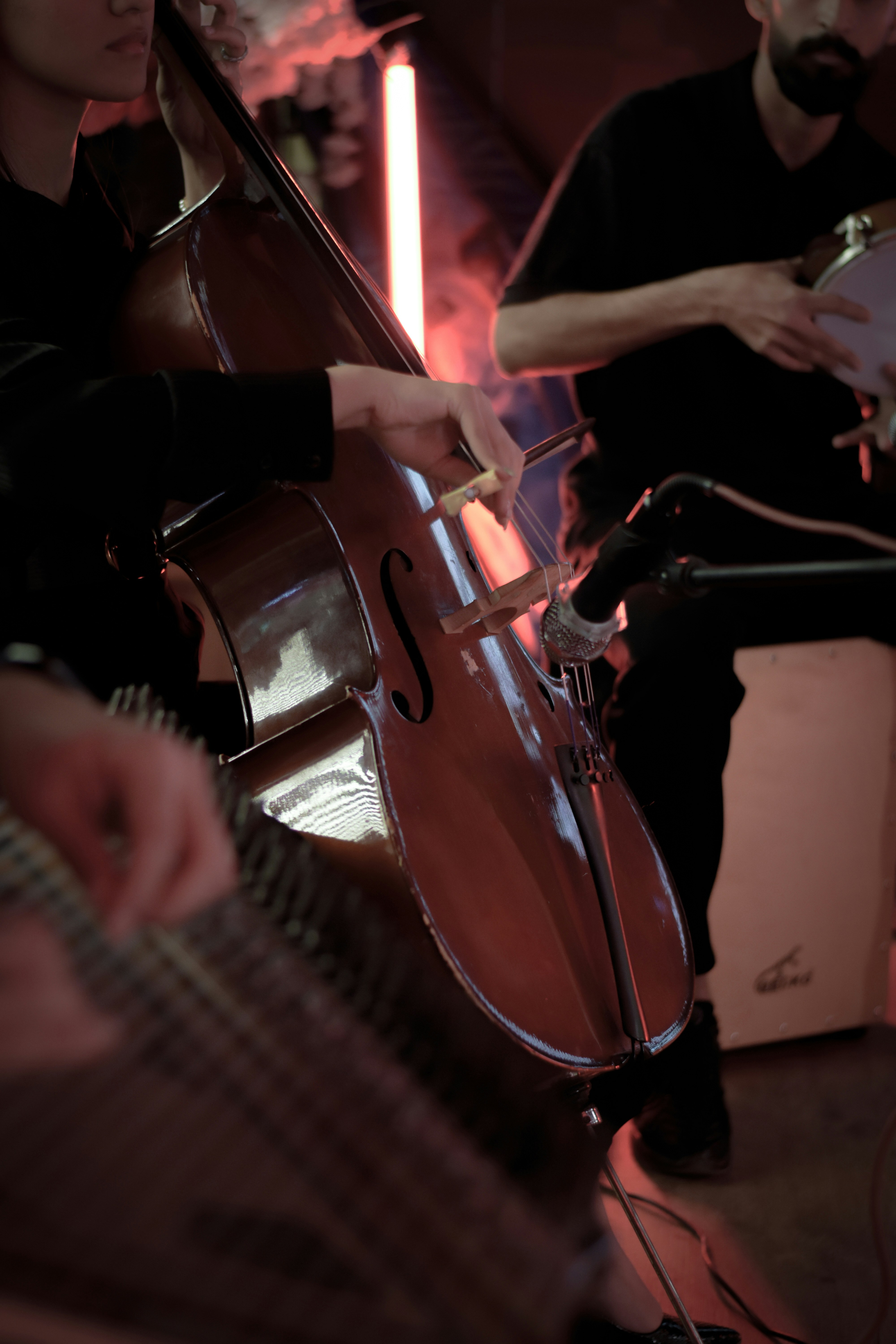 a group of people playing instruments in a room
