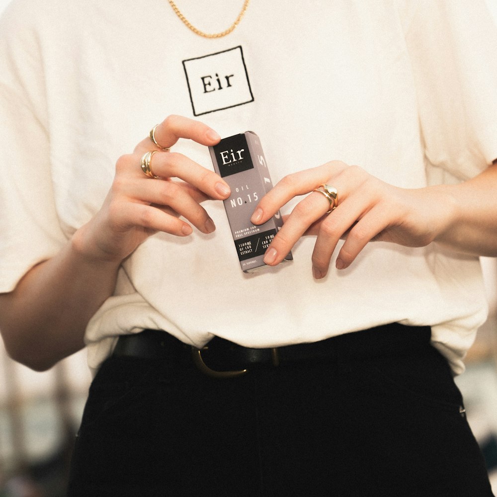 a woman holding a cell phone in her hands