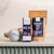 Several wellness products are arranged on a surface. There is a box labeled 'Eir Health Sleep No. 10' that indicates it contains CBD products for calming and sleep aid, featuring evening oil with lavender and melatonin. Beside it, a pouch labeled 'Midnight Chill' contains bath salts. In front, there is a bath bomb with a subtle gray and blue design.