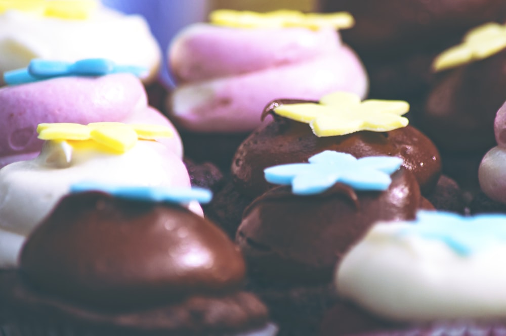 a close up of a bunch of cupcakes on a table