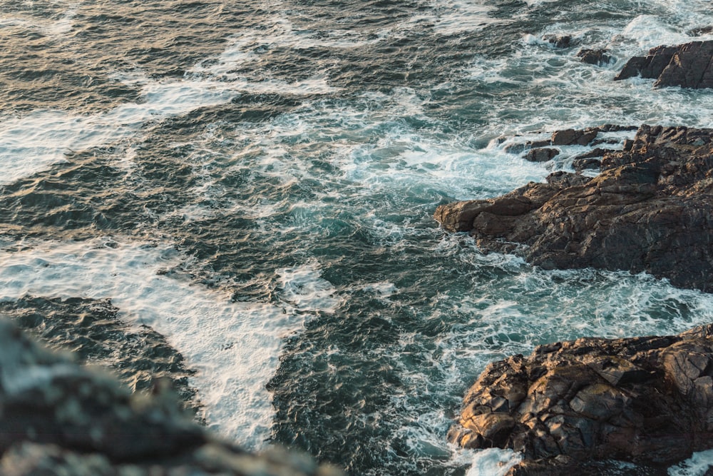 a view of the ocean from the top of a hill