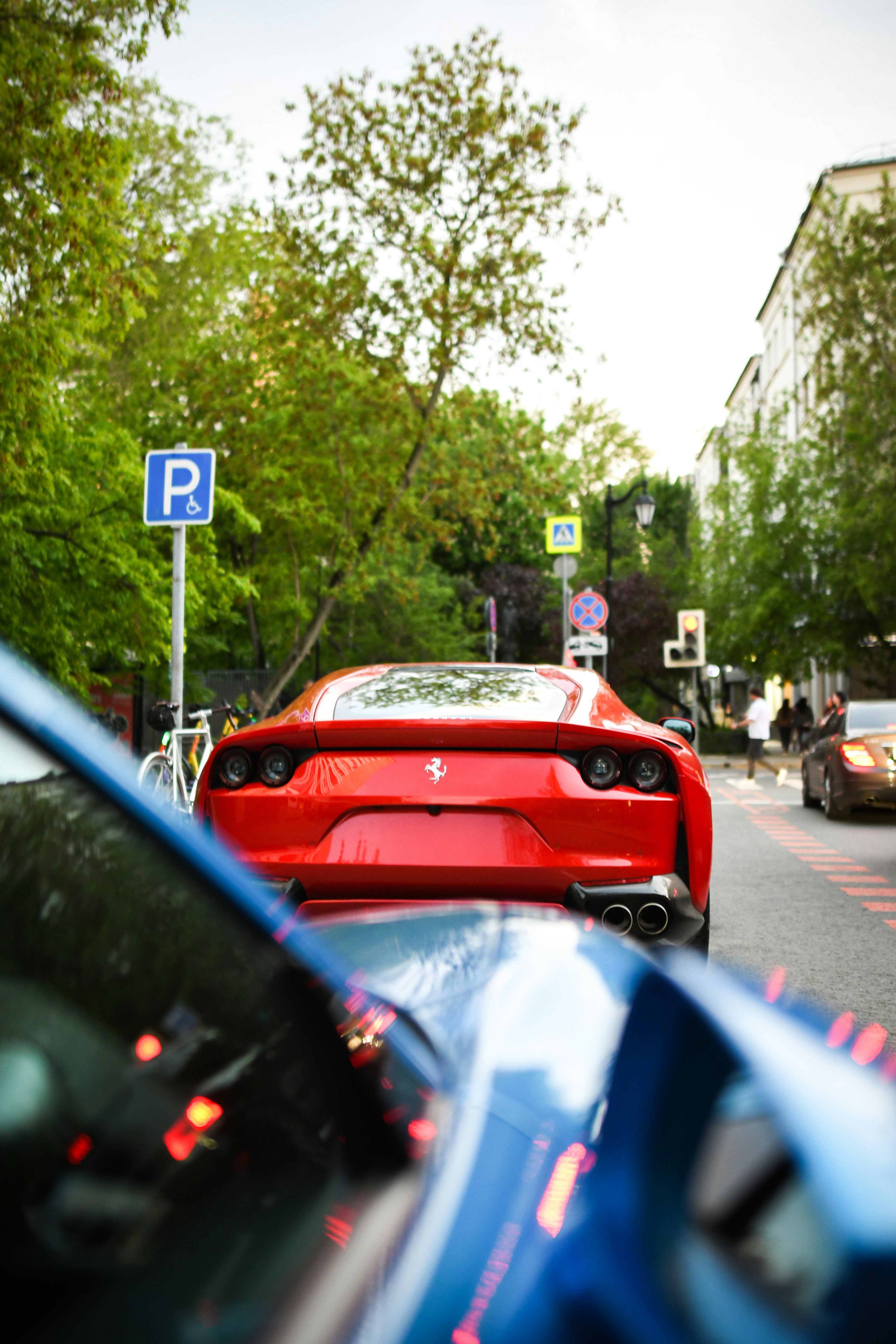 a red sports car parked on the side of the road