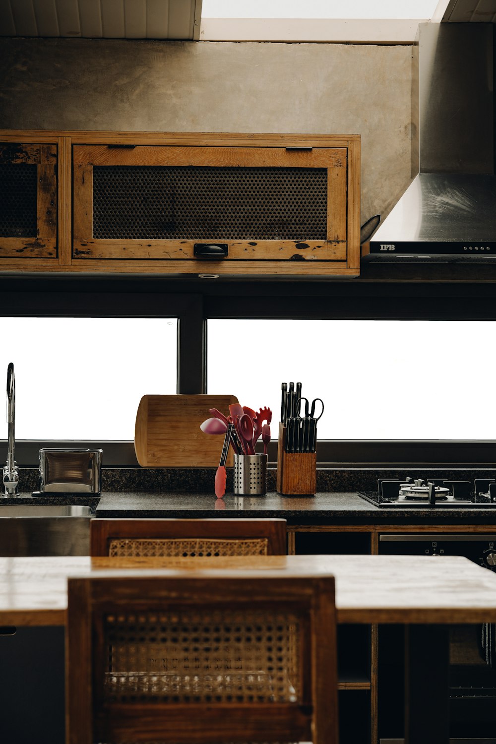 a kitchen with a stove top oven next to a counter