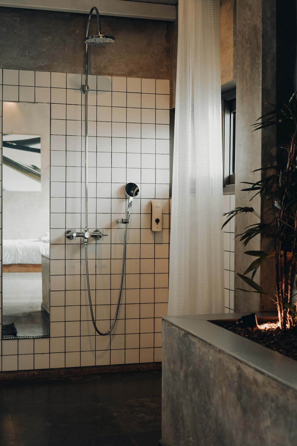 a bathroom with tiled walls and a shower