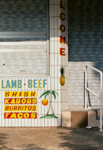 A welcoming storefront of a Mexican restaurant proudly displaying the Sabores Unidos membership plaque.