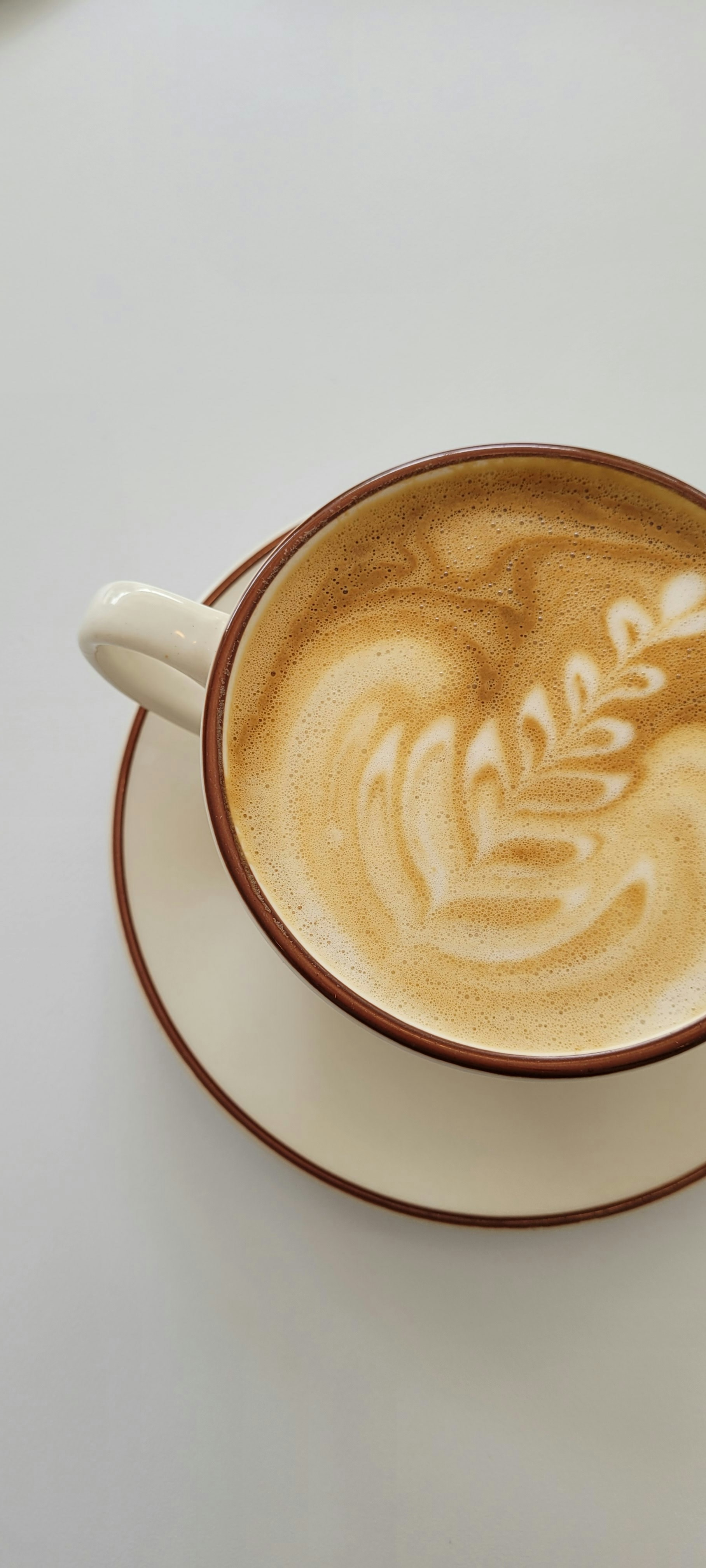 a cup of coffee with a saucer on a saucer