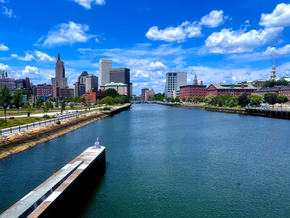 a body of water with a city in the background