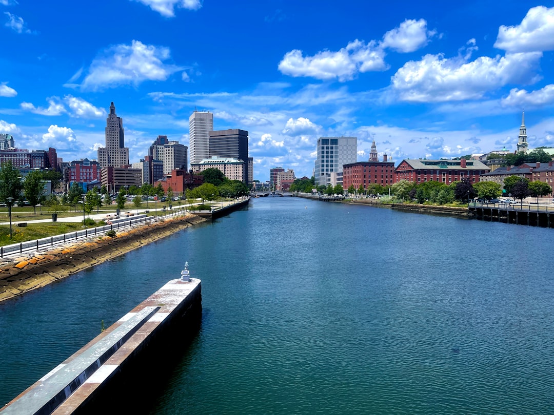a body of water with a city in the background,
