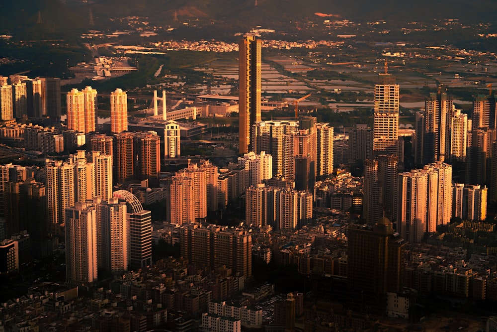 an aerial view of a city with tall buildings