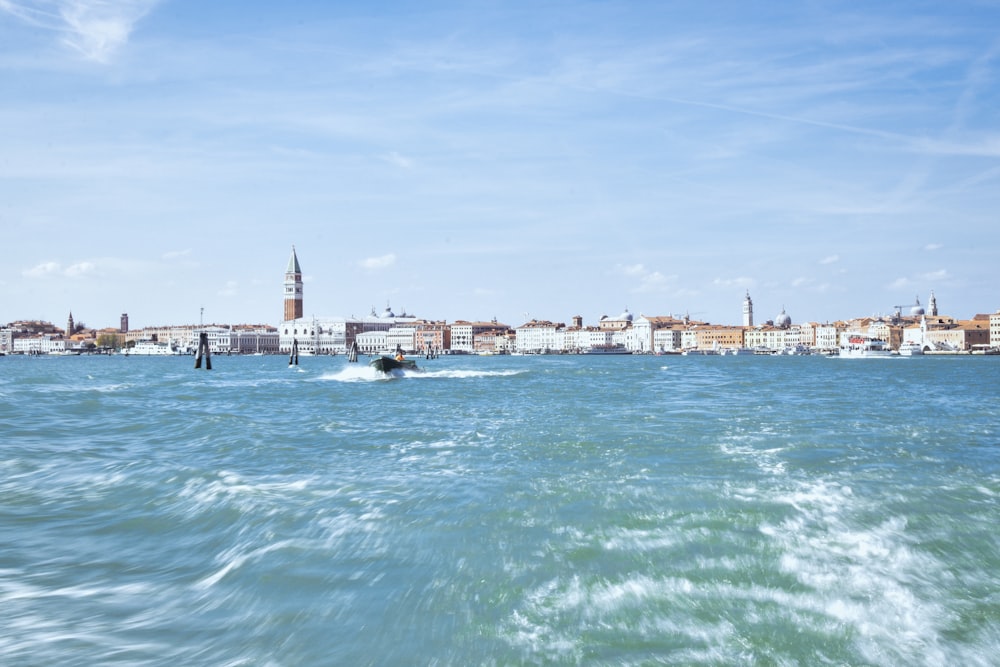 a view of a body of water with a city in the background