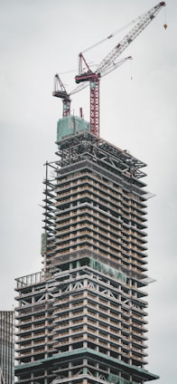 a tall building with a crane on top of it