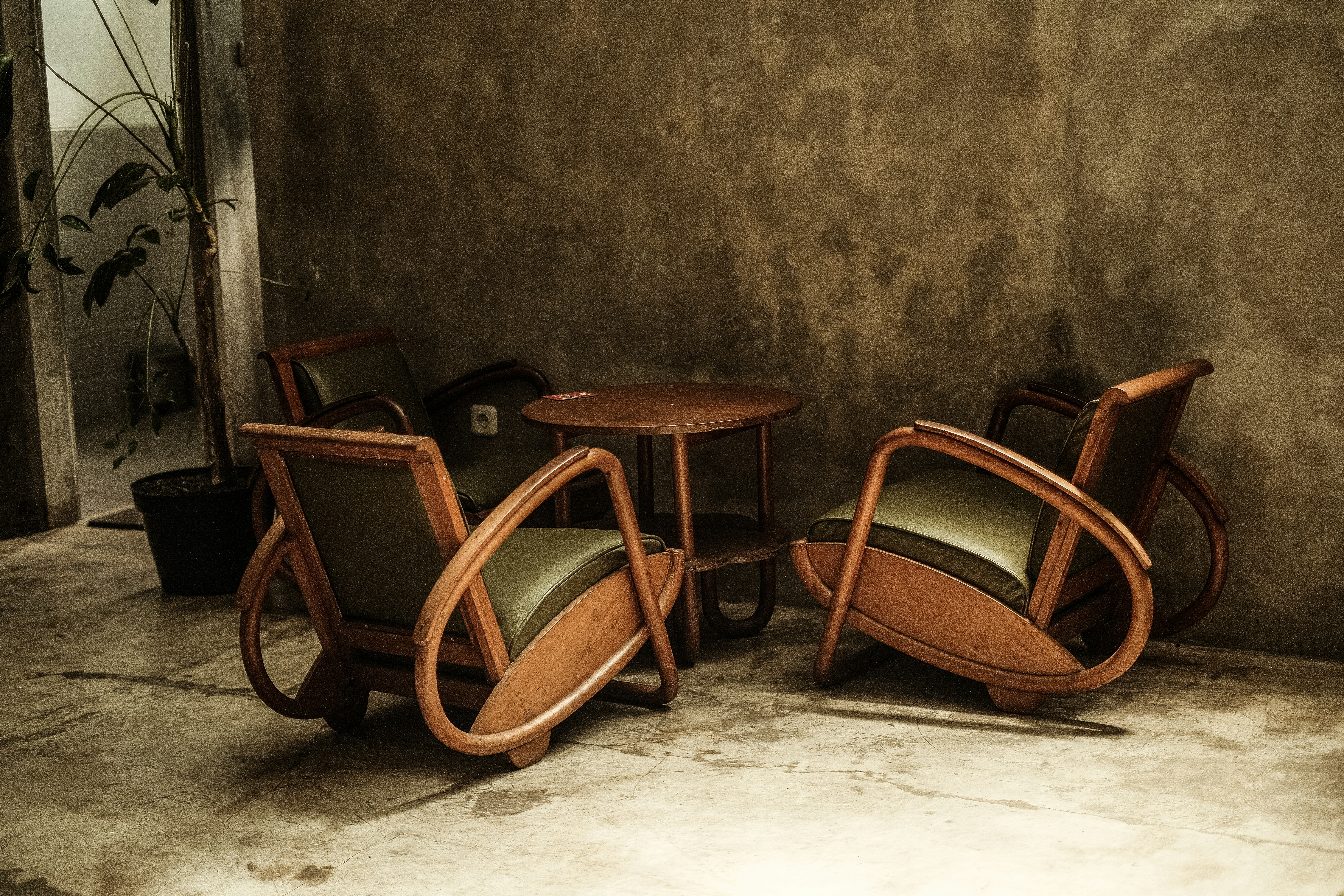 a couple of chairs sitting next to a table