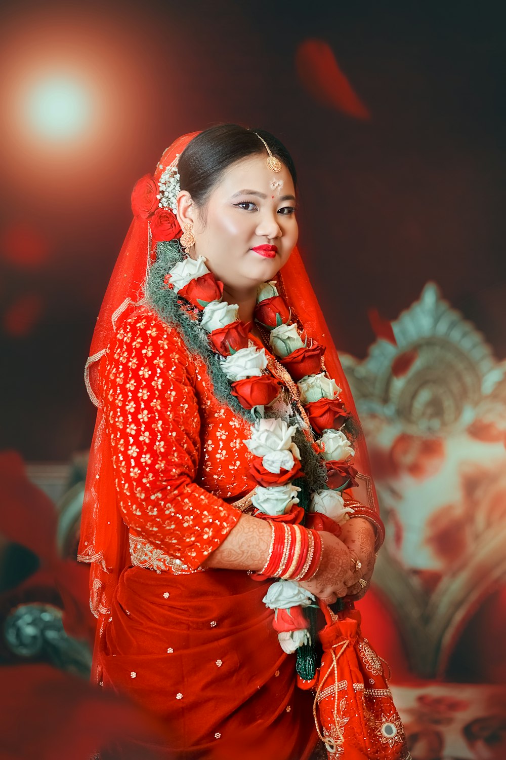 a woman in a red dress with a red shawl