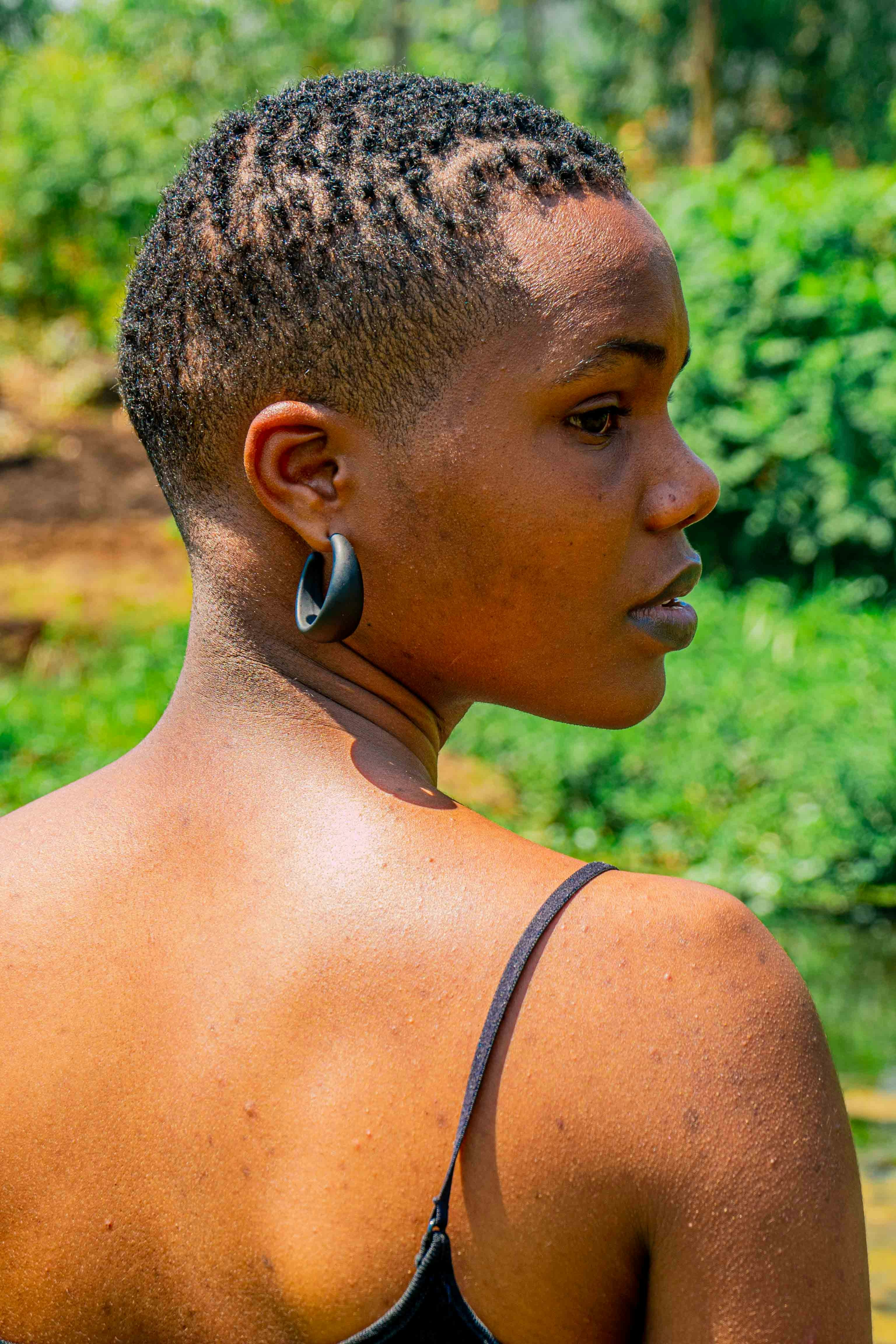 a close up of a person wearing a tank top