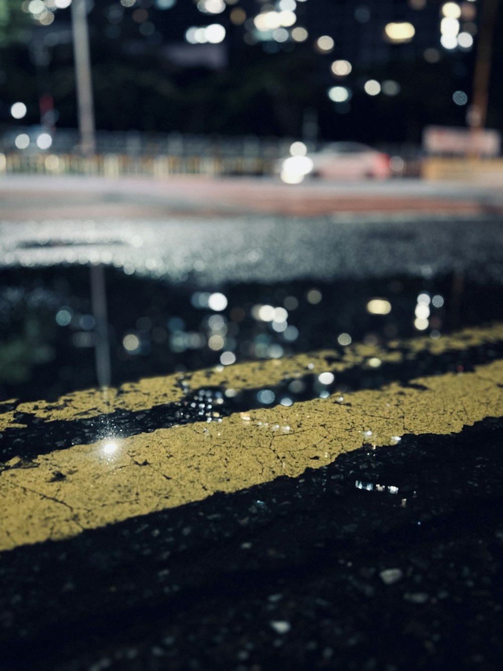 a puddle of water sitting on the side of a road