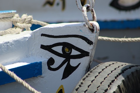 a close up of a boat with an eye of Horus symbol painted on it
