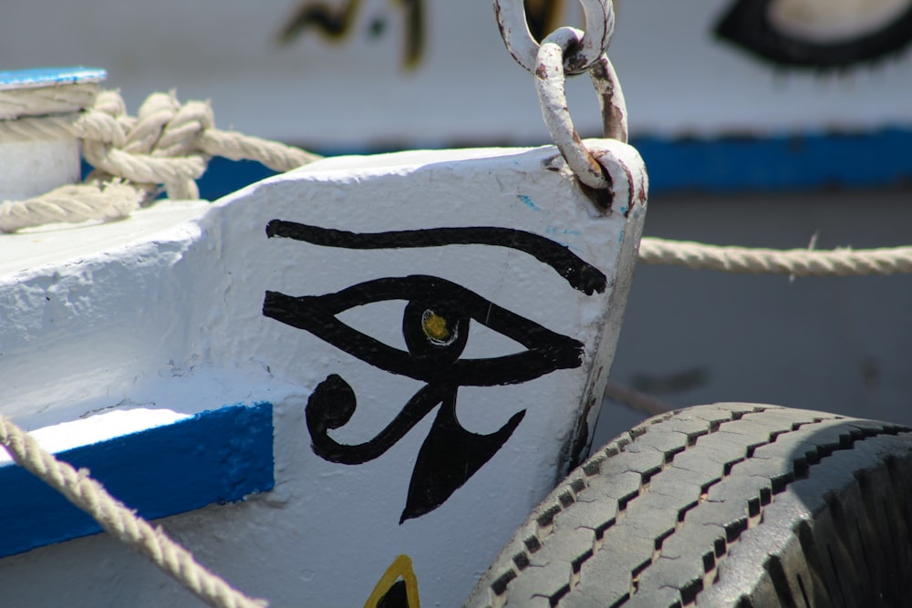 a close up of a boat with an eye painted on it