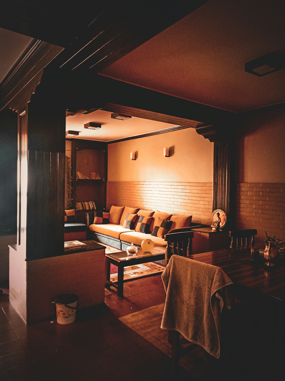 a living room filled with furniture and a large mirror