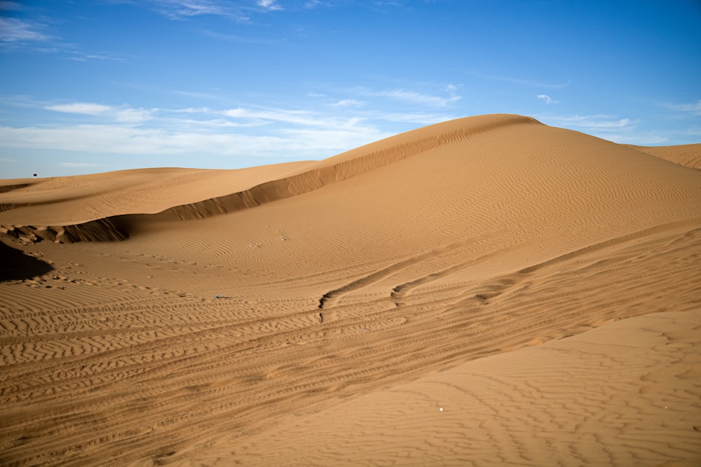 a large sand dune in the middle of a desert