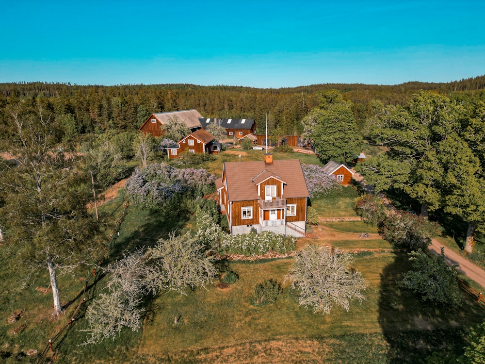 an aerial view of a home surrounded by trees