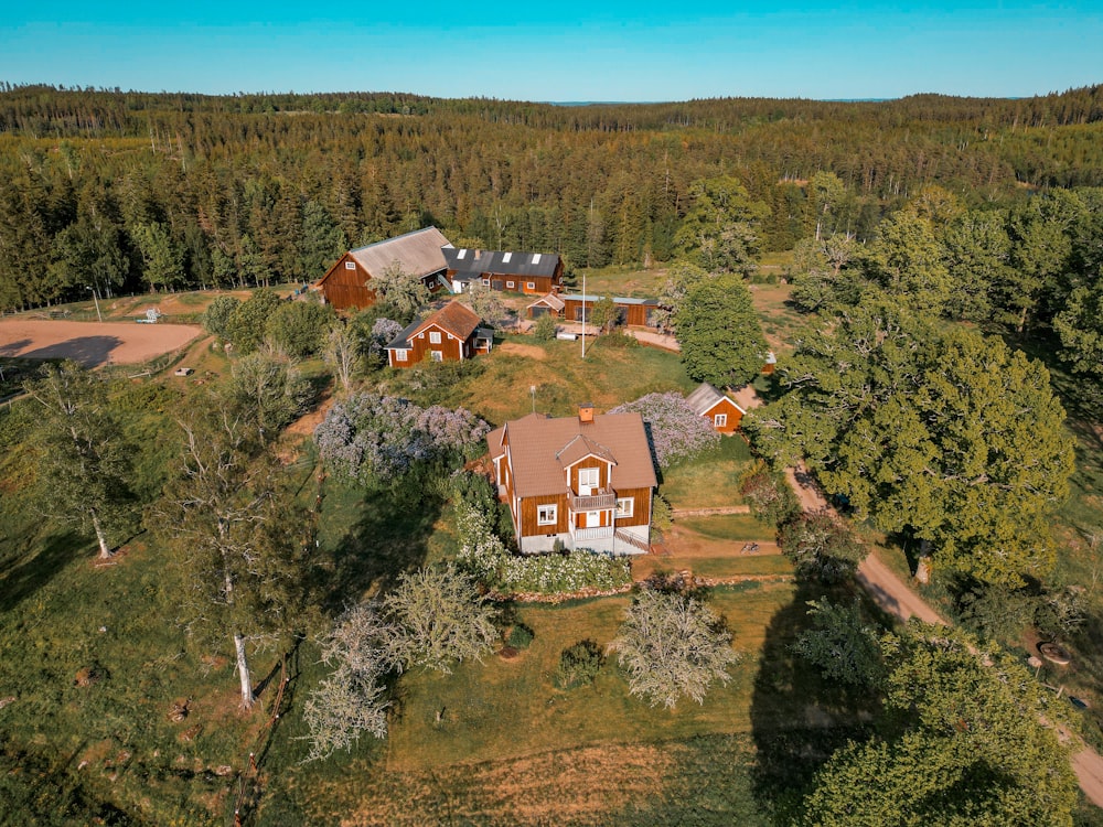 an aerial view of a home surrounded by trees