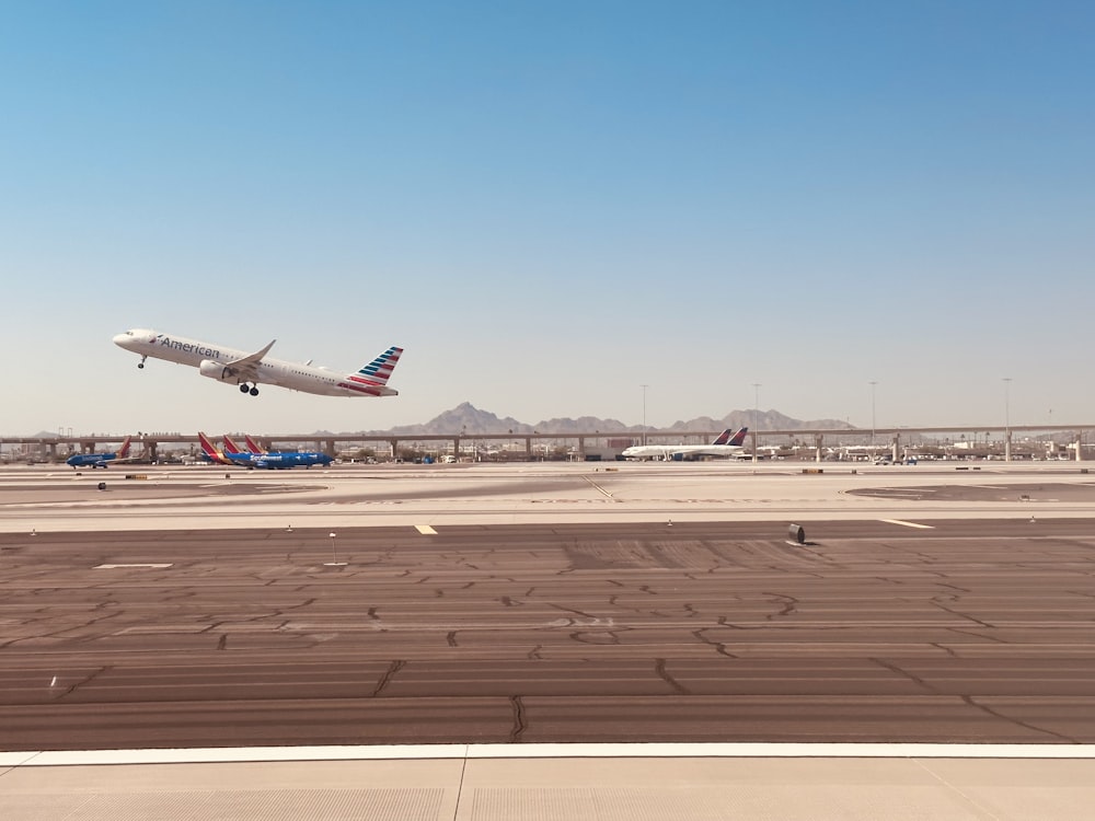 an airplane taking off from an airport runway