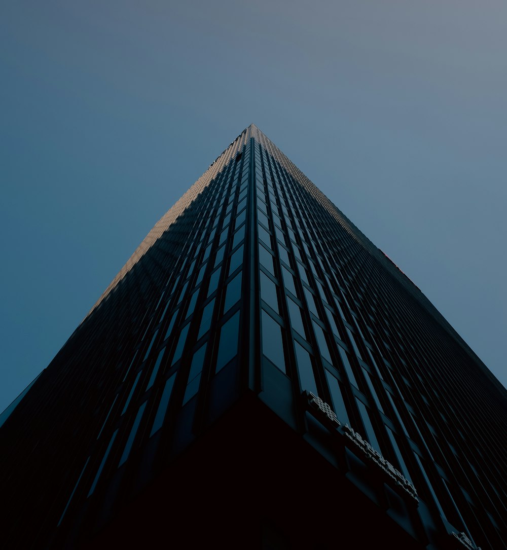looking up at the top of a tall building