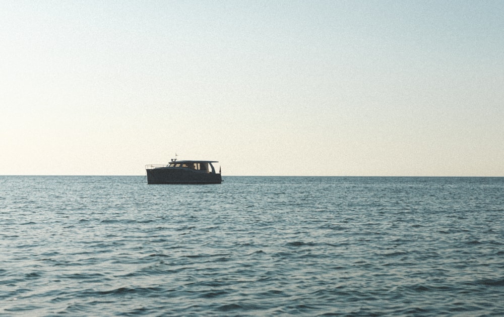 a boat floating on top of a large body of water