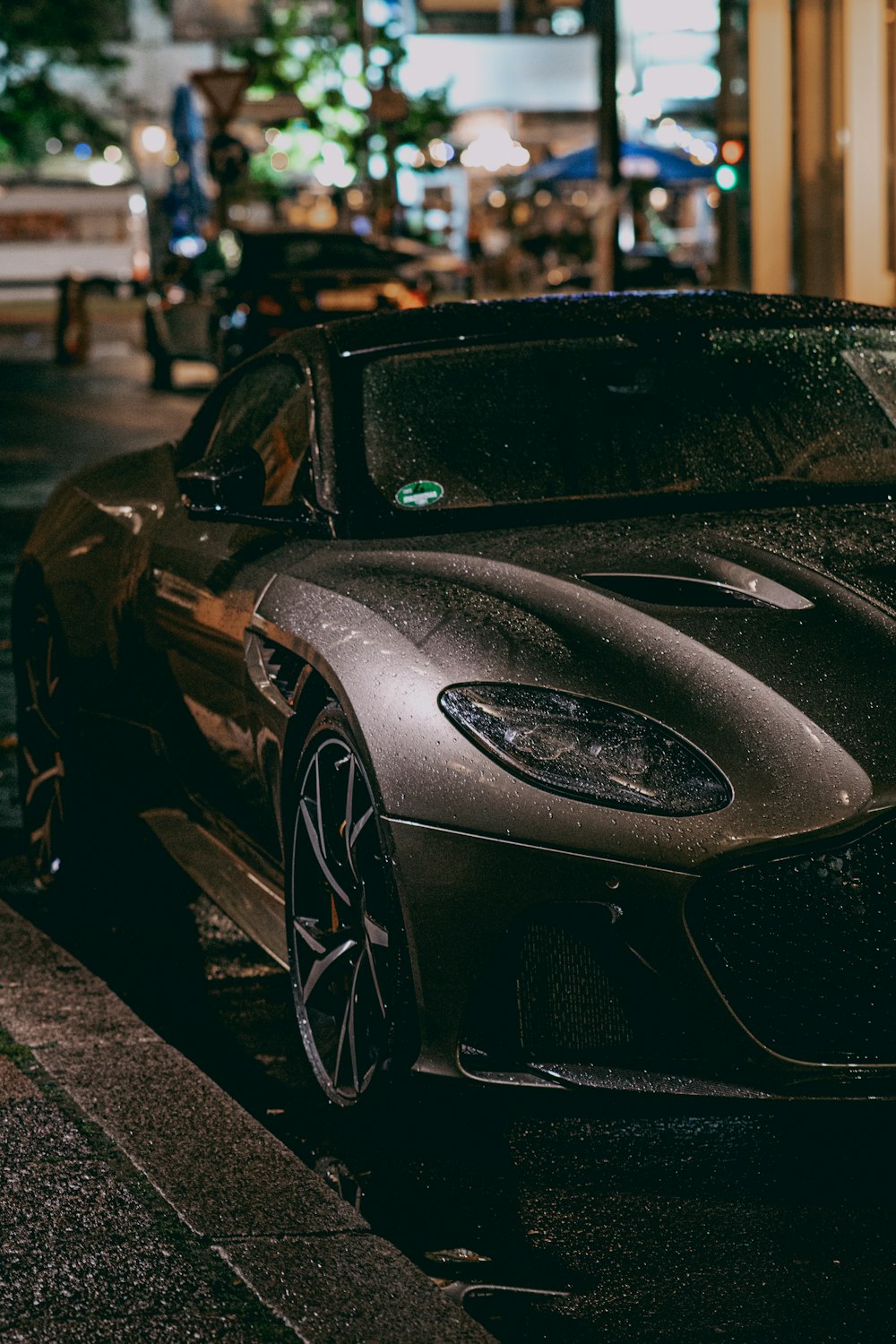 a black sports car parked on the side of the road