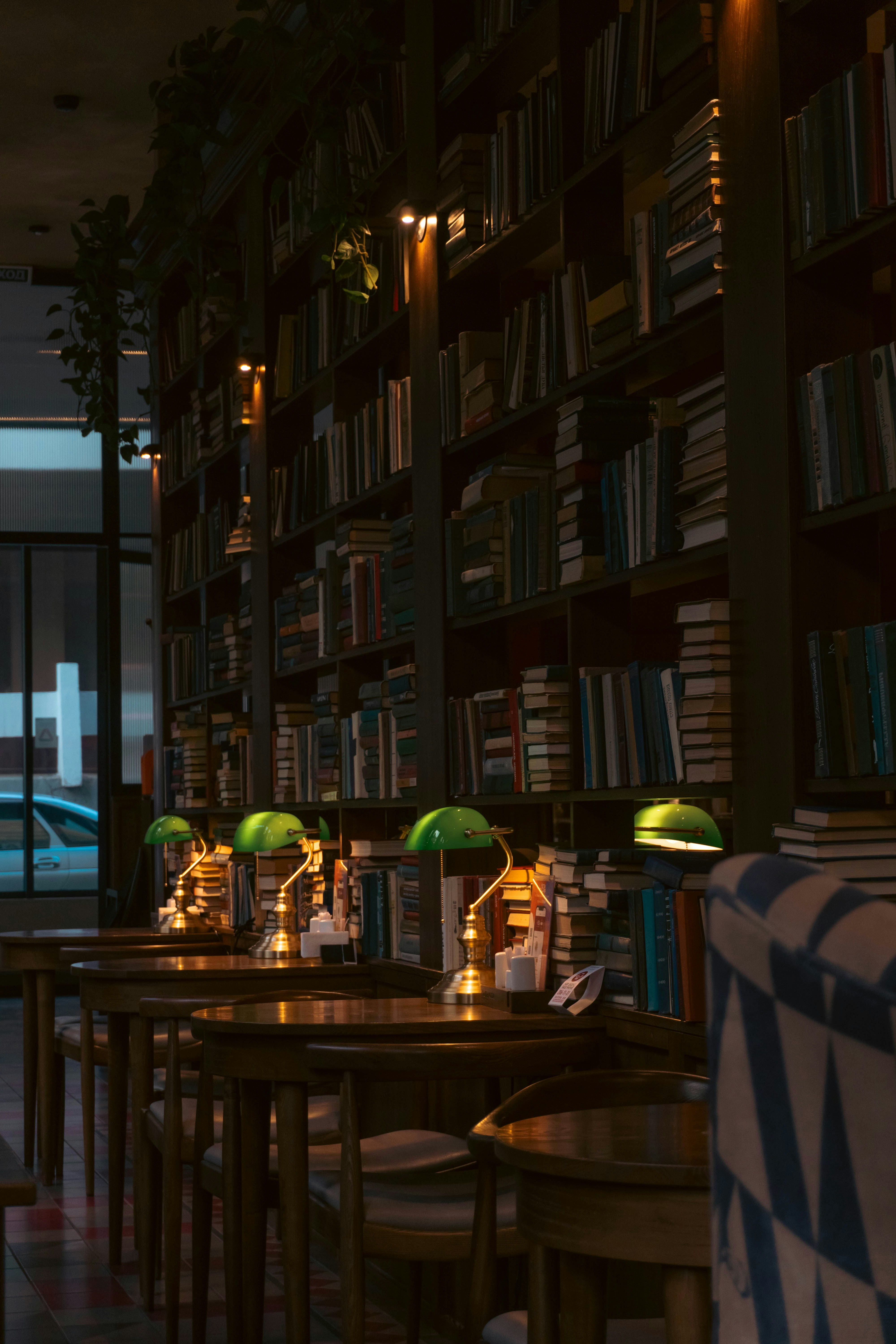 a dimly lit room with tables and chairs