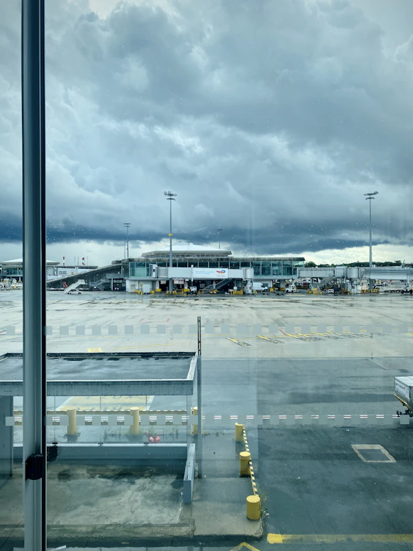 Aircraft seen through an airport terminal window before departure