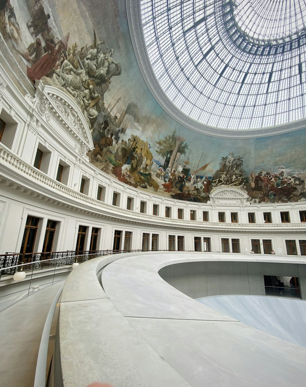 the ceiling of a building with a painting on it