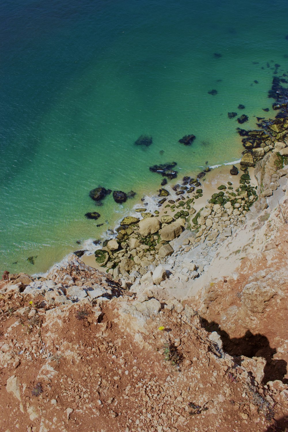 a view of a body of water from a cliff